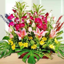 Pink Lilies, Roses & Orchids Basket Arrangement